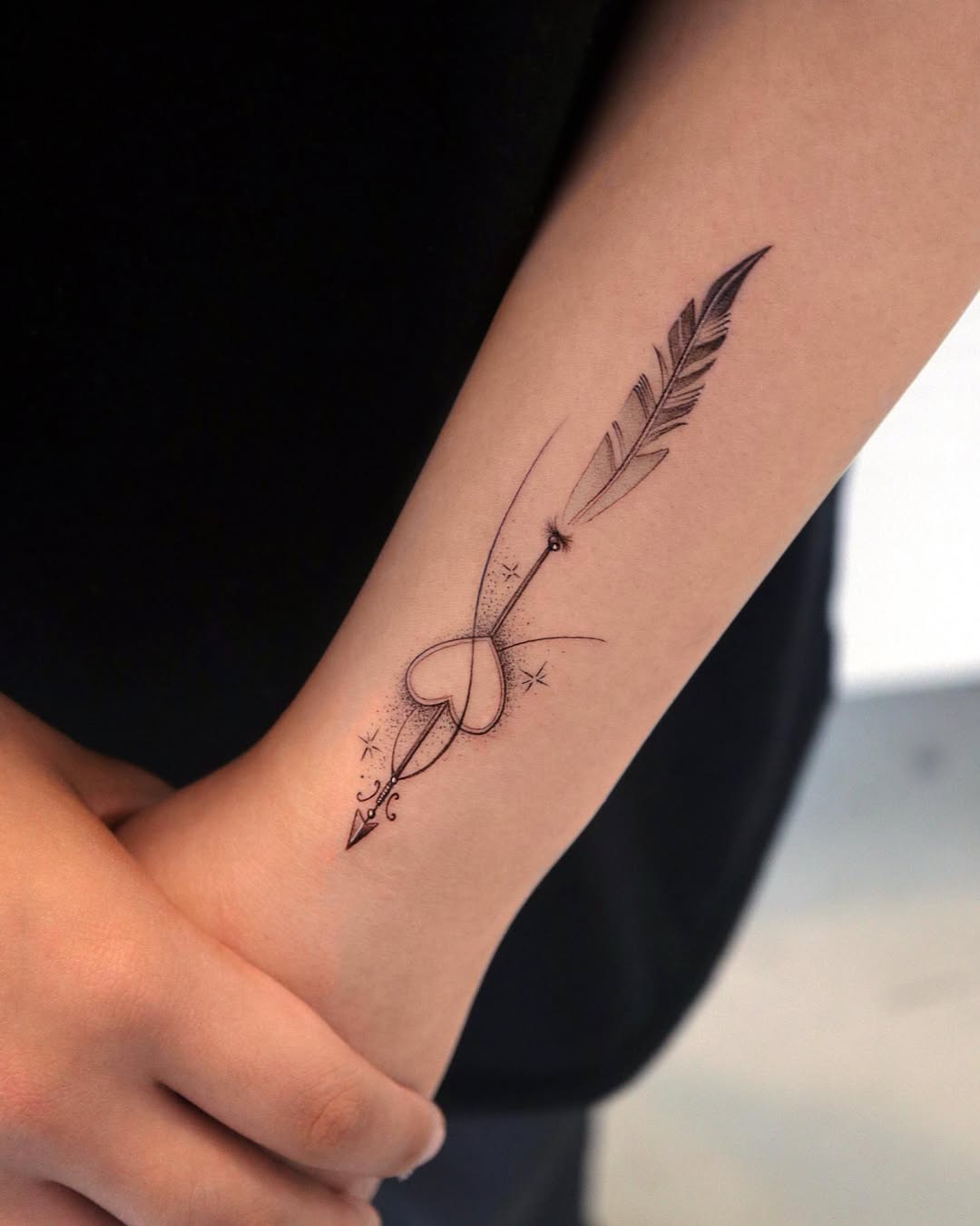 Minimalist Sagittarius Tattoo with Heart Design