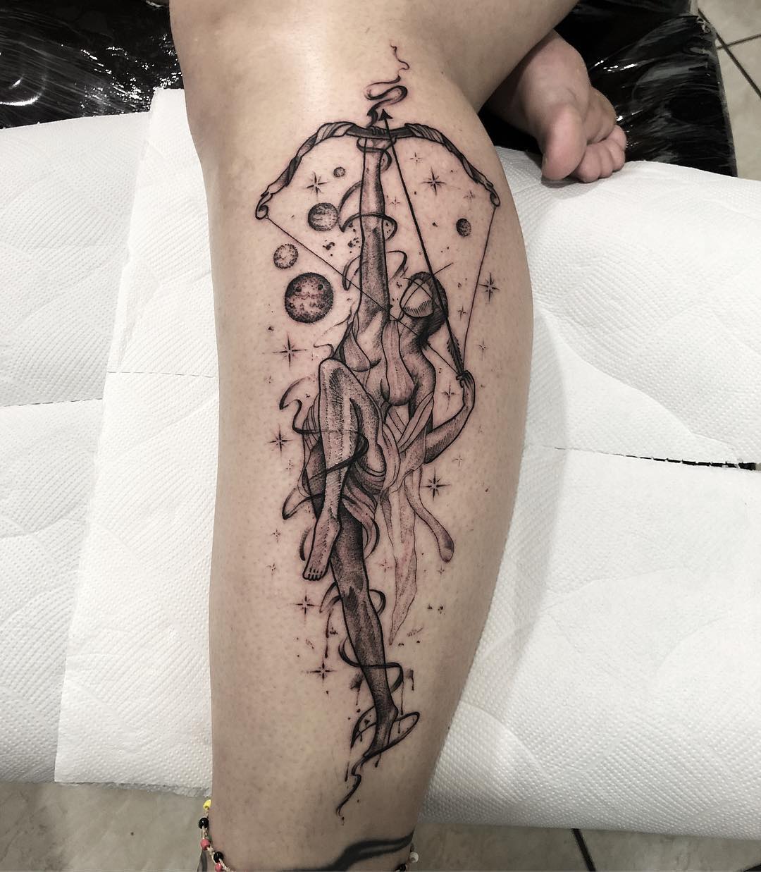 Captivating Sagittarius tattoo with cosmic elements