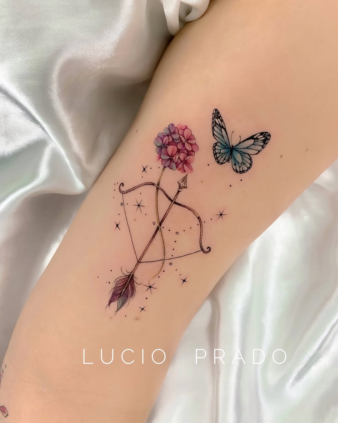 Elegant Sagittarius tattoo with floral and butterfly elements