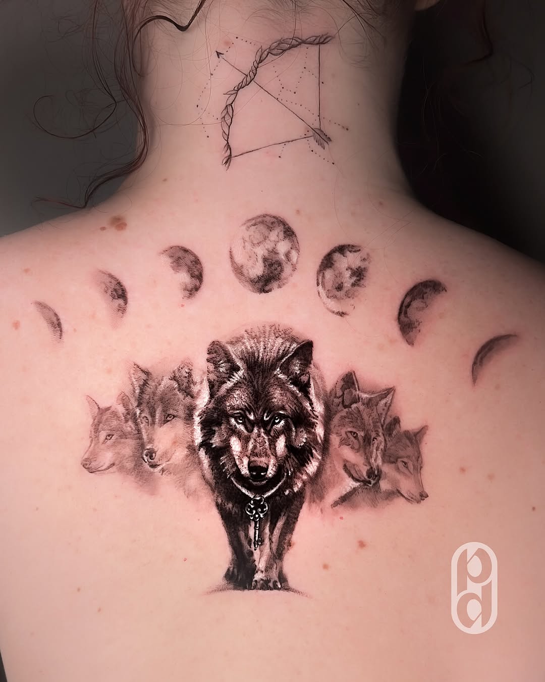 Intricate Sagittarius tattoo featuring wolves and moons