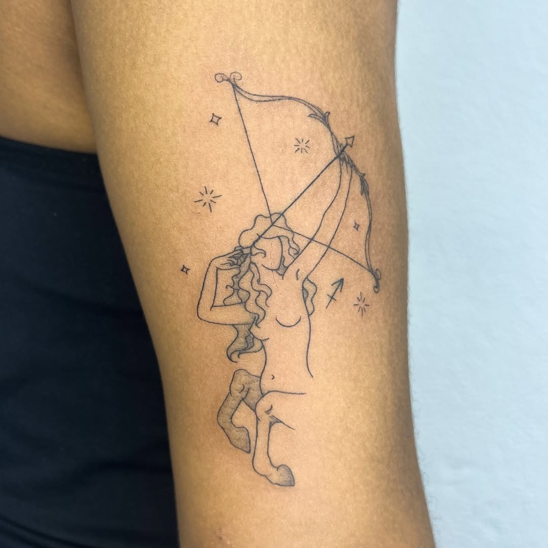 Elegant Sagittarius Tattoo with Celestial Elements
