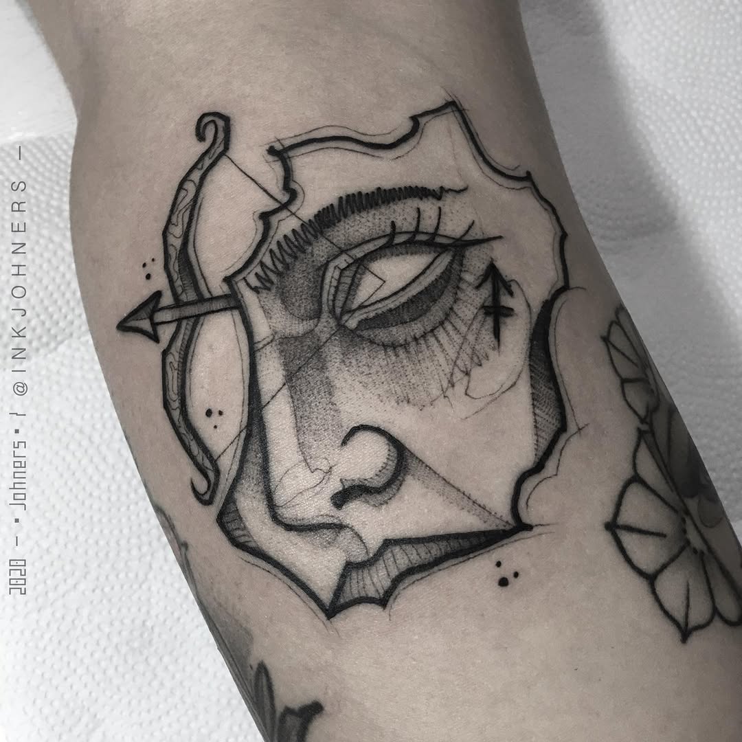 Modern Sagittarius tattoo with abstract elements