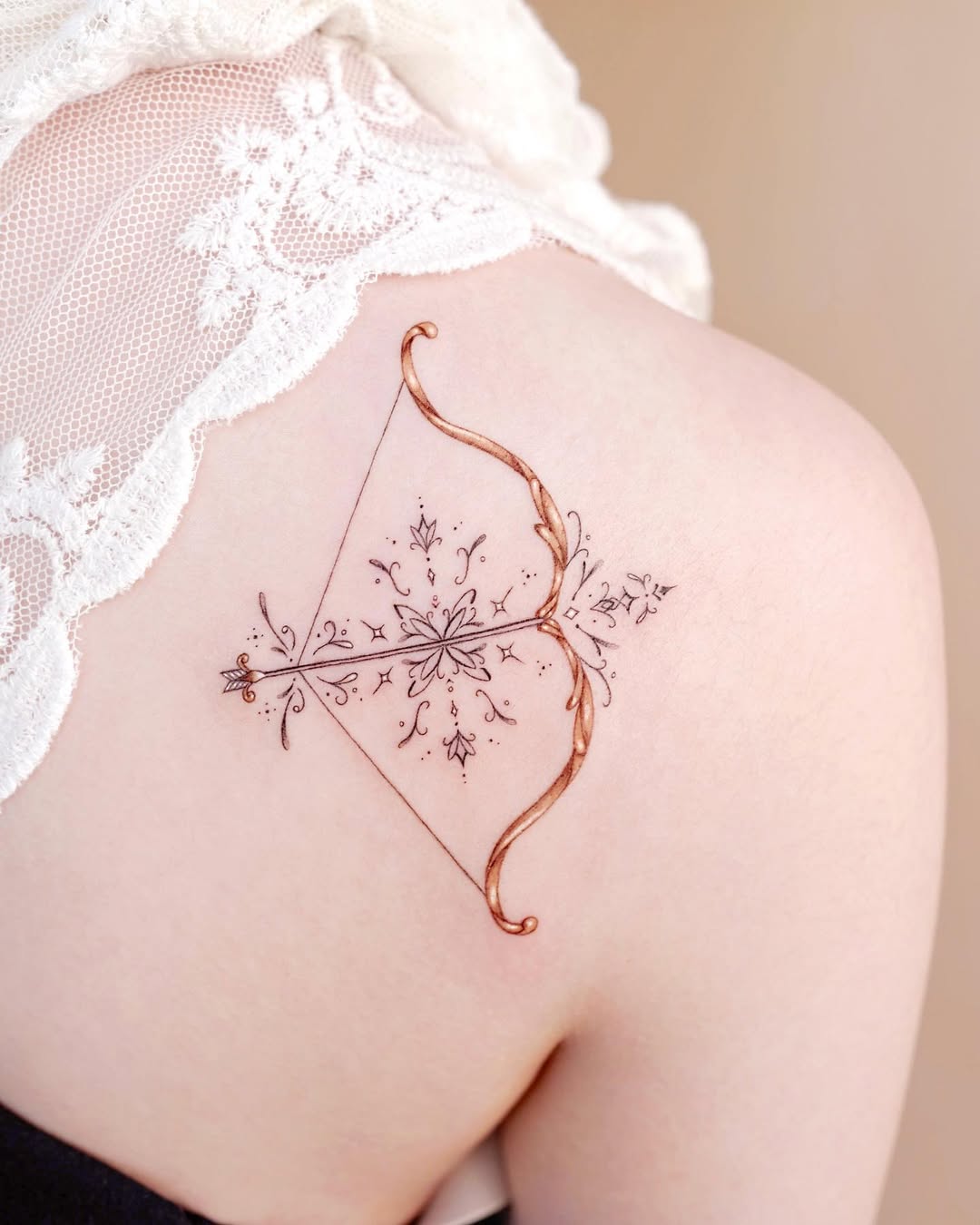 Elegant Sagittarius bow and arrow tattoo design