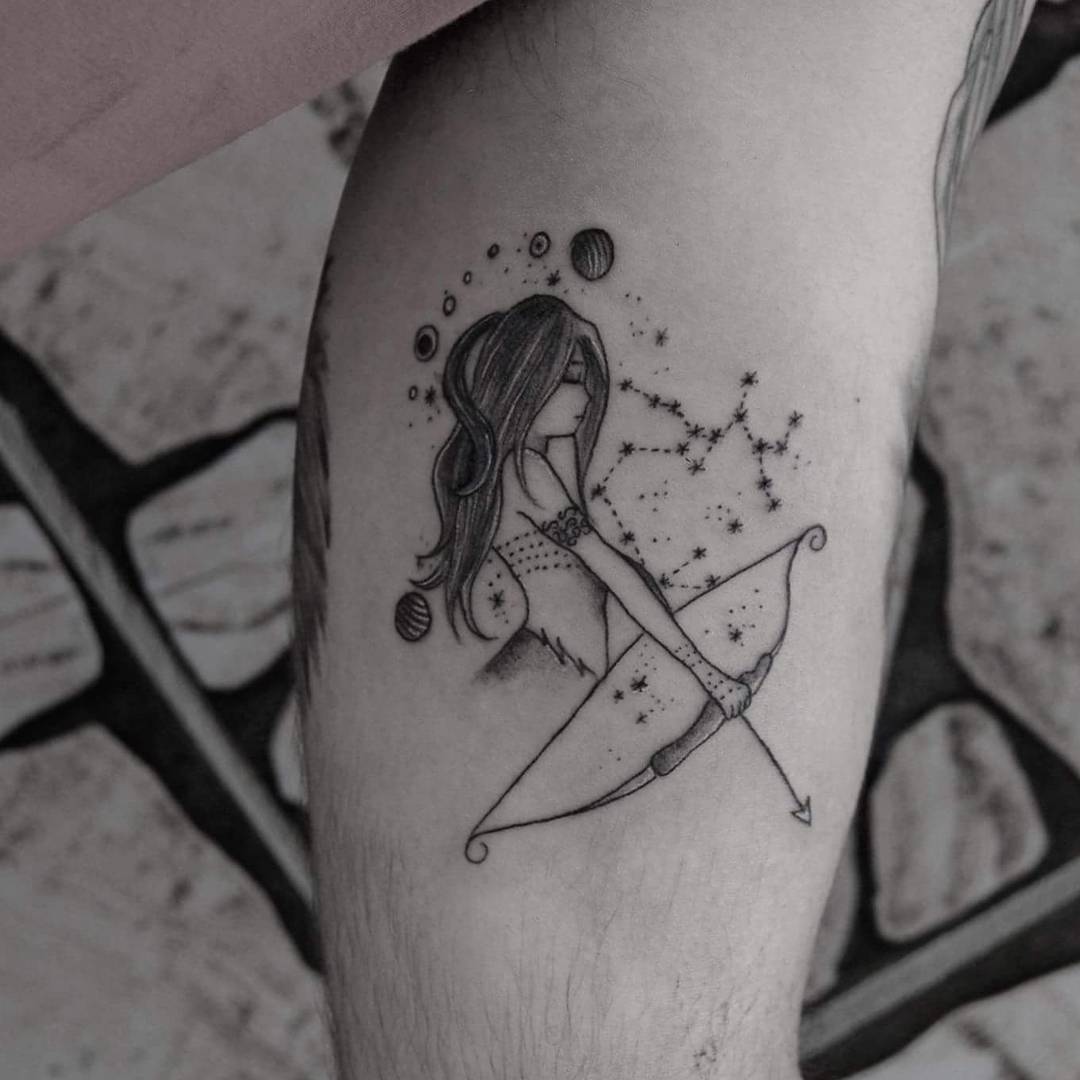 Feminine Sagittarius tattoo with cosmic elements