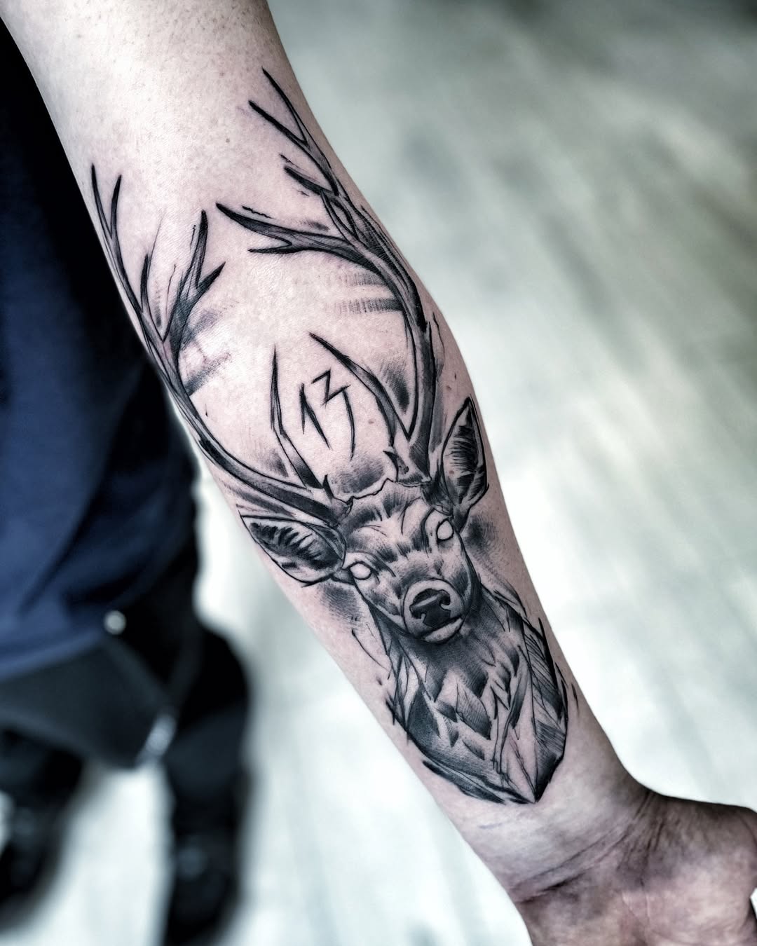 Detailed stag tattoo with majestic antlers