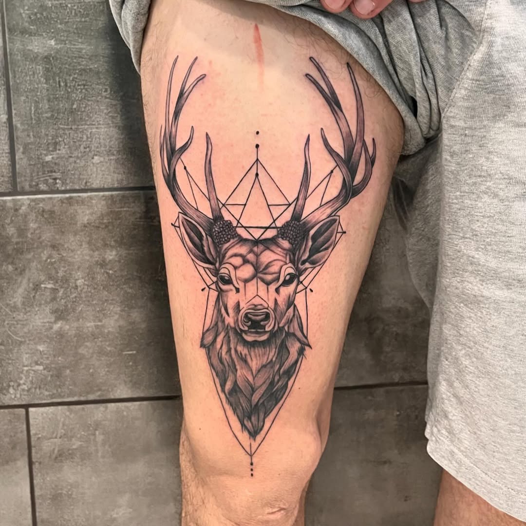 Majestic geometric stag tattoo with intricate design