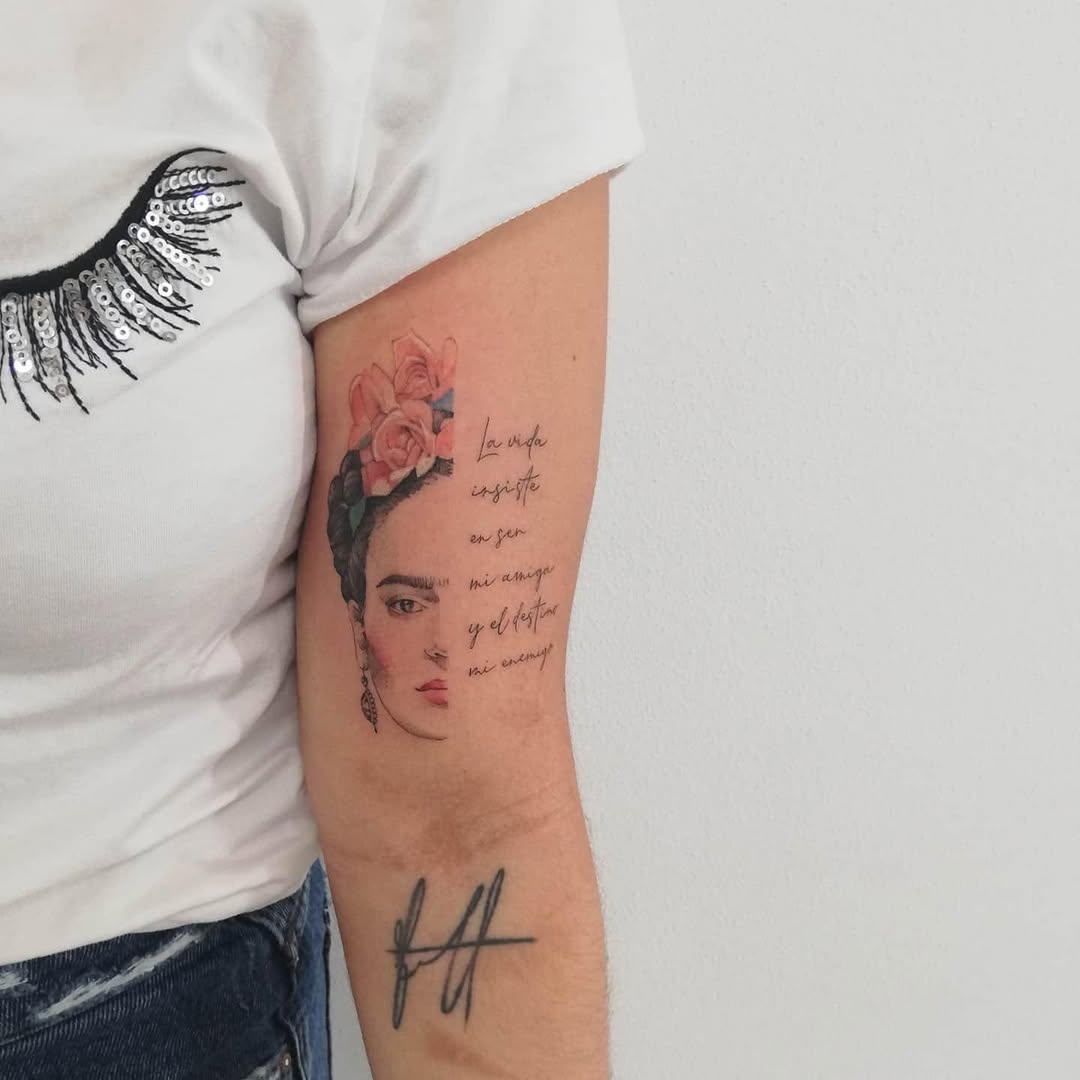 Whimsical Frida Kahlo Tattoo with Floral Accents