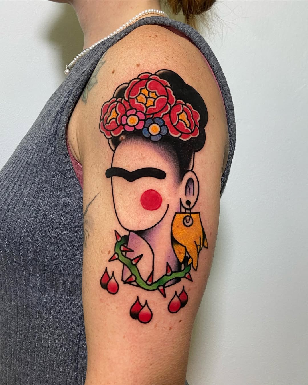 Vibrant Frida Kahlo Tattoo with Floral Accents