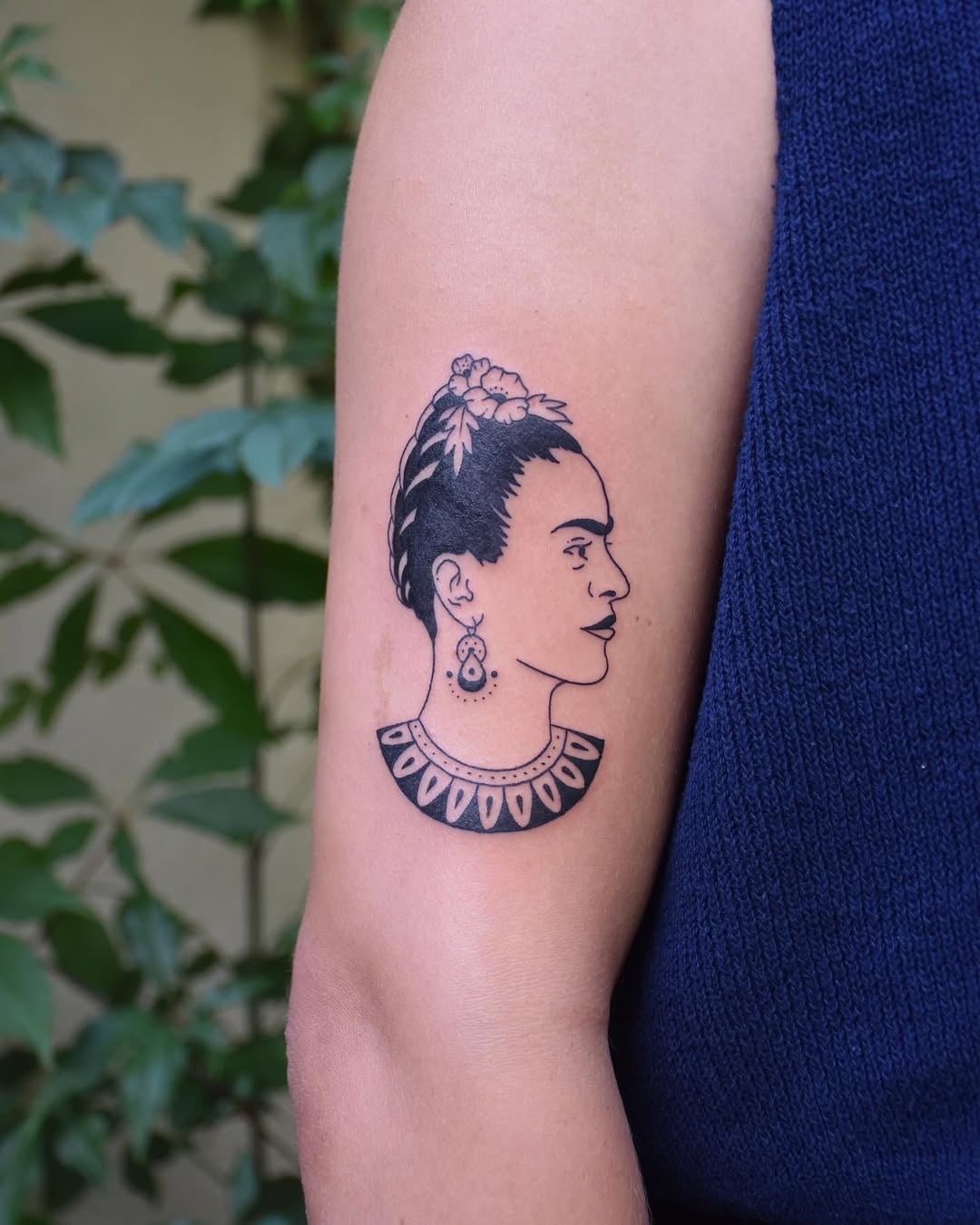 Elegant profile tattoo of Frida Kahlo