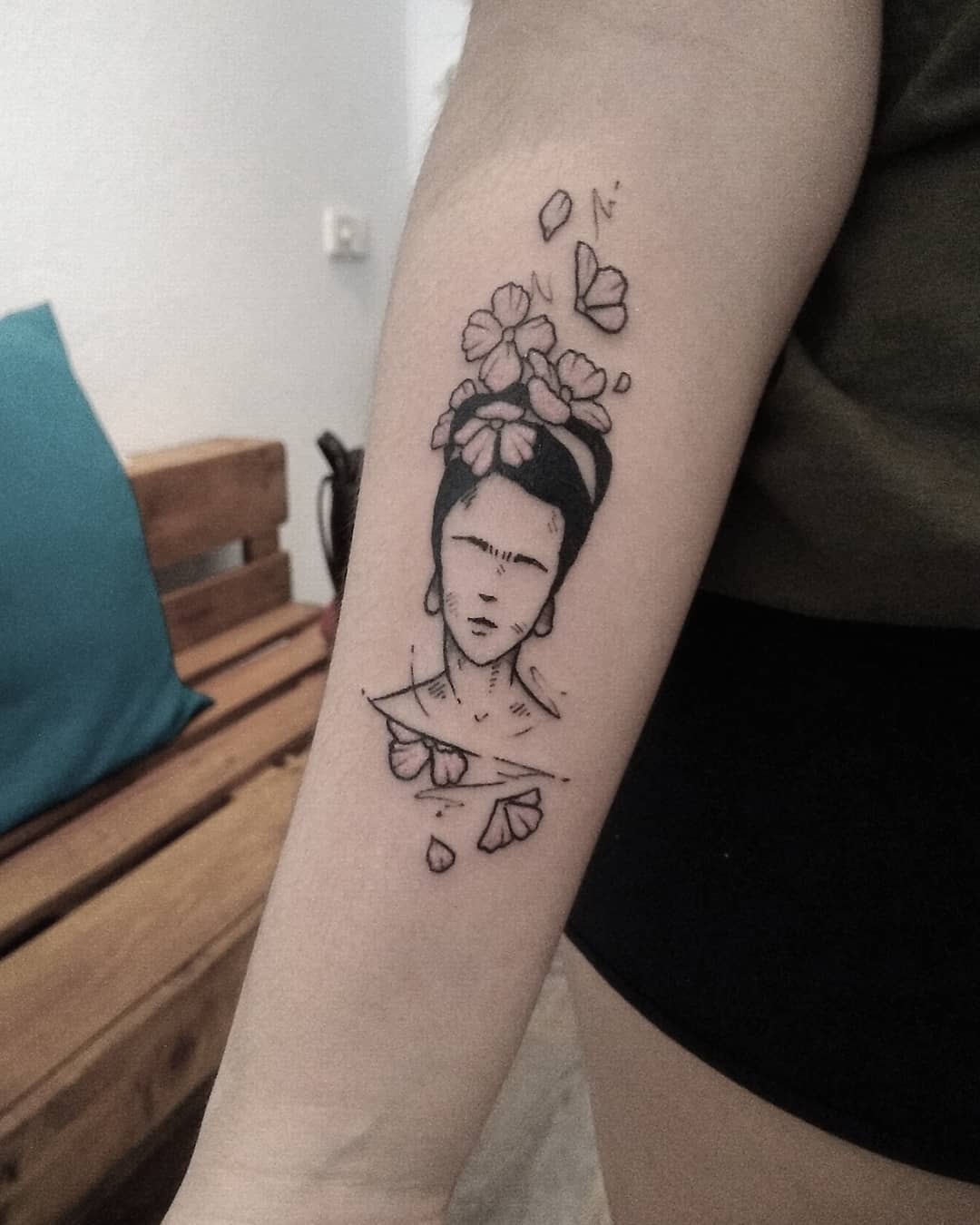 Intricate Frida Kahlo Tattoo with Floral Elements