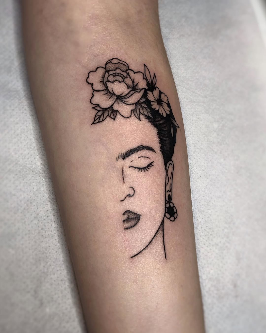 Elegant Frida Kahlo Inspired Floral Tattoo