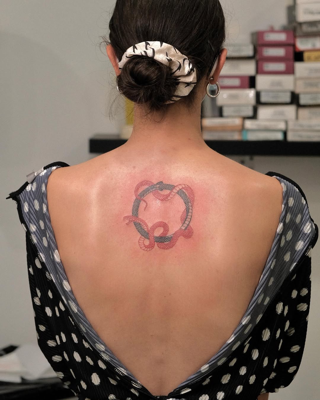 Intricate Ouroboros Tattoo with Subtle Color