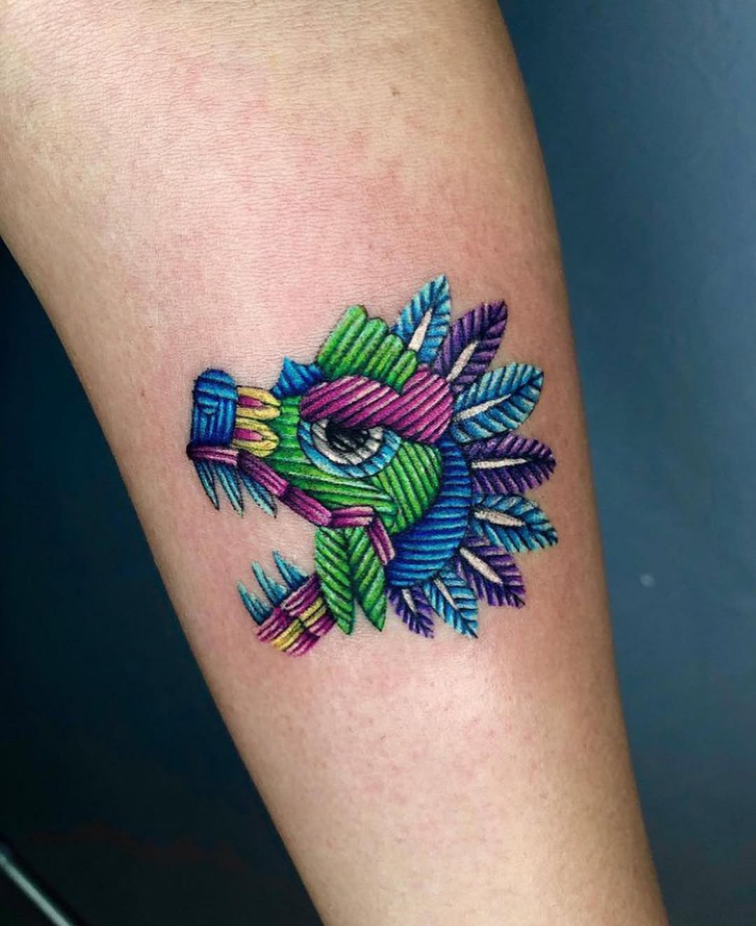 A vibrant dragon tattoo with unique colors.