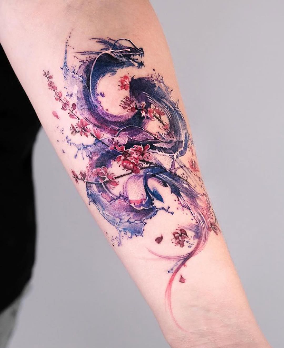 Stunning dragon tattoo with floral elements