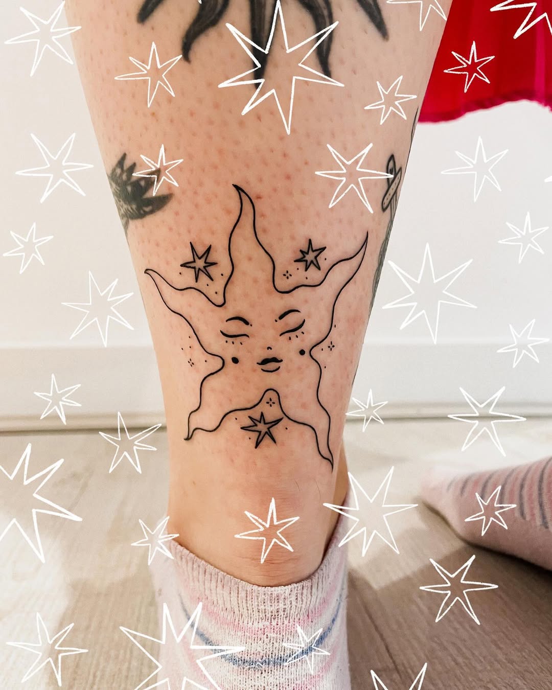 Mystical star face tattoo on the leg